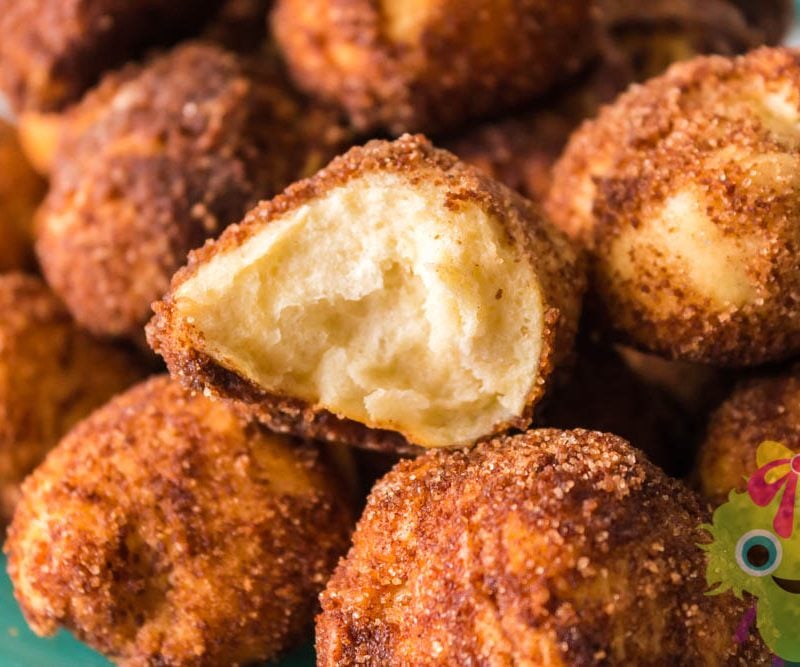 Cinnamon sugar ball cut in half on top of whole balls
