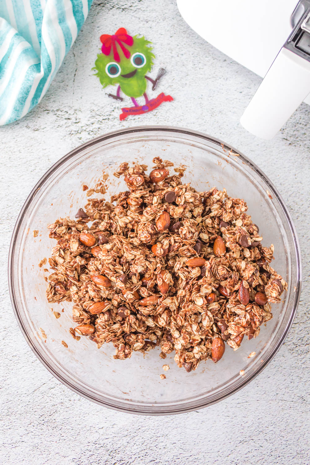 Almonds, chocolate chips, and oats coated with Nutella syrup.