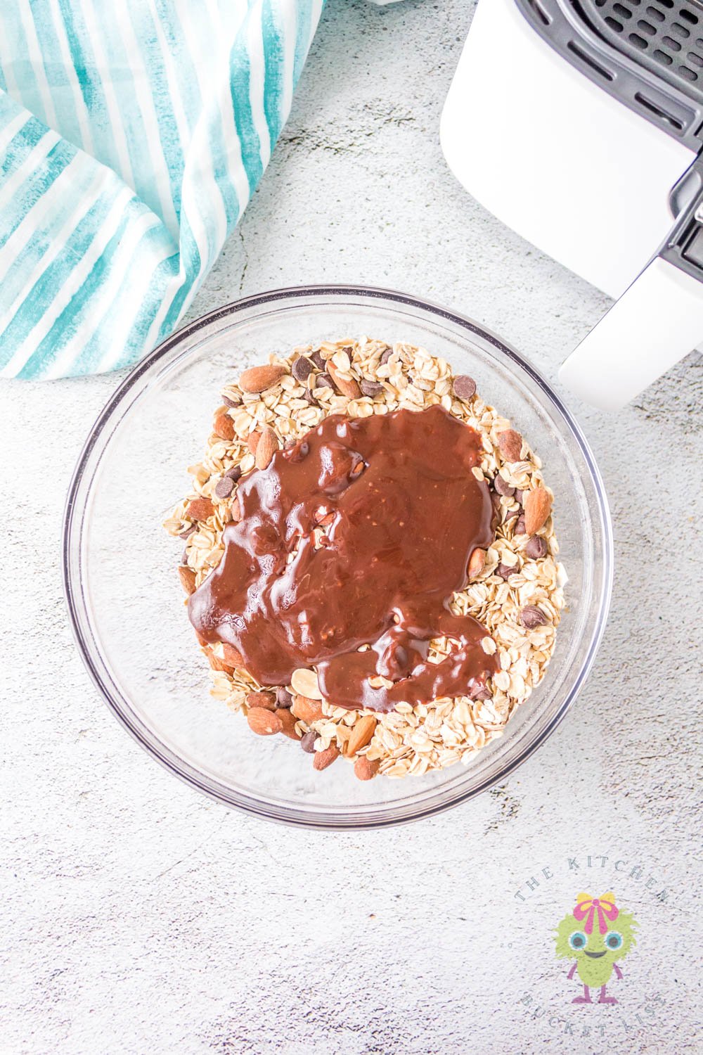 Pouring the Nutella syrup over the ingredients.