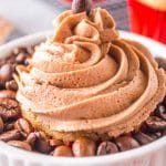 esspreso cupcake in a bowl filled with coffee beans