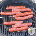 Choose your favorite smoking wood to have smoked sausage done in a few hours. You can easily make smoked bratwurst and smoked Italian sausage at the same time. Eight sausages smoked on the smoker's grill grate.