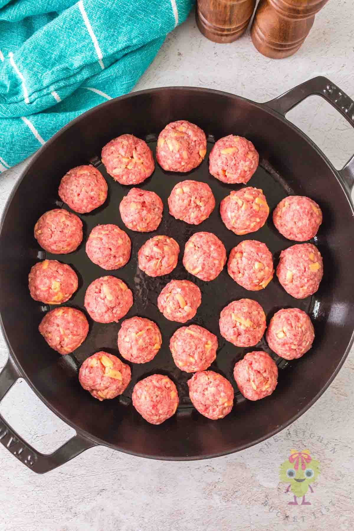 Mini cheeseburger balls spaced perfectly, ready for the smoker.