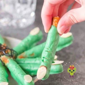 Get ready to cast a spell on snack time with these Halloween pretzels! The picture show a witch finger pretzel above a plate of witch finger pretzels. So grab your broomsticks and let’s get munching!