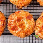 A mini pizza done in the air fryer with pepperoni, it is perfectly cooked.