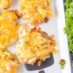 Five ooey-gooey Colby Jack cheese smashed Baby Dutch Yellow potatoes with crispy bits of cheese on the sides, waiting to be served.