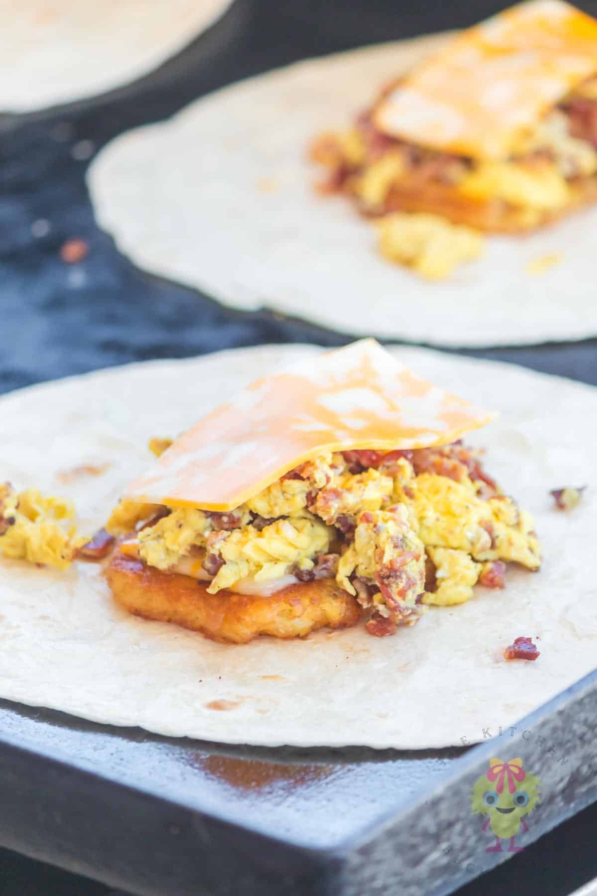 Tortillas with the crunchwrap ingredients on top, ready to fold.