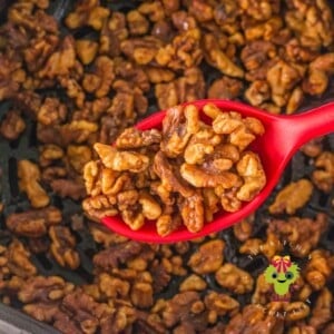 Perfectly roasted walnuts done in the air fryer. They have a beautiful golden color from the addition of honey and cinnamon.