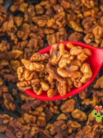 Perfectly roasted walnuts done in the air fryer. They have a beautiful golden color from the addition of honey and cinnamon.
