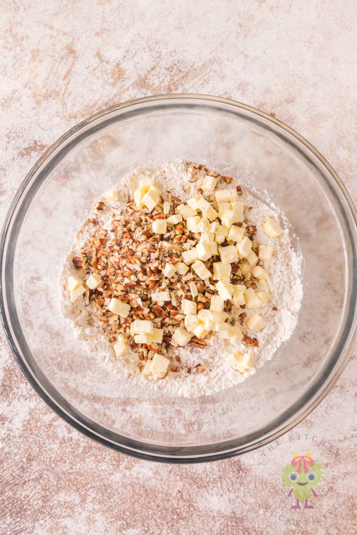 An overhead picture showing the 8 ingredients to make the dough. Remember to keep the cubed butter cold until mixing the dough.
