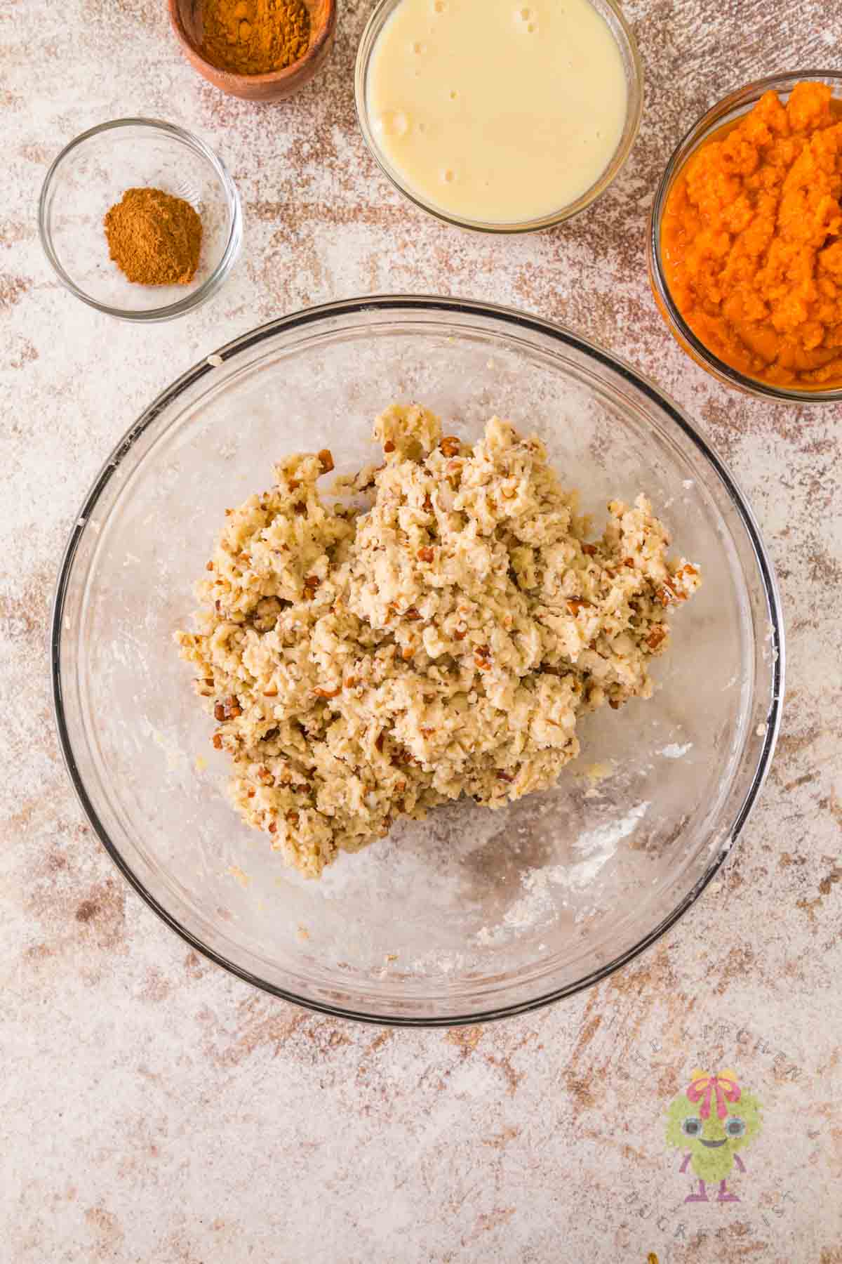 The cake crumble mixture with chopped pecans.
