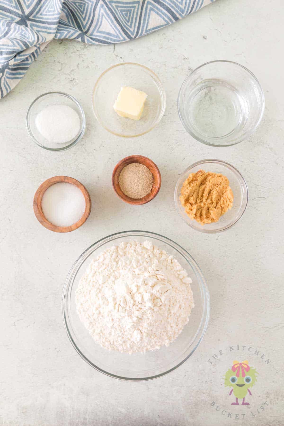 Seven simple pantry ingredients arranged on a counter and ready for making a homemade cinnamon sugar snack.